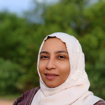 Dr Alya Mohamed smiles at the camera