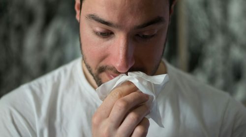 flu vaccines 2025 - man with runny nose