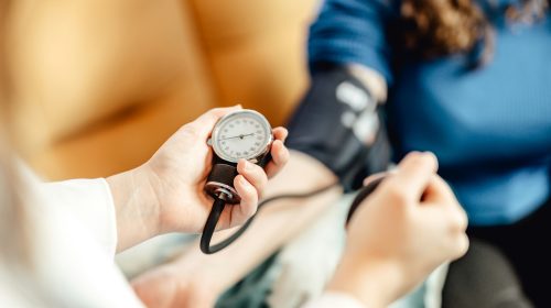 Blood pressure being checked by doctor - essential health checks for 30+